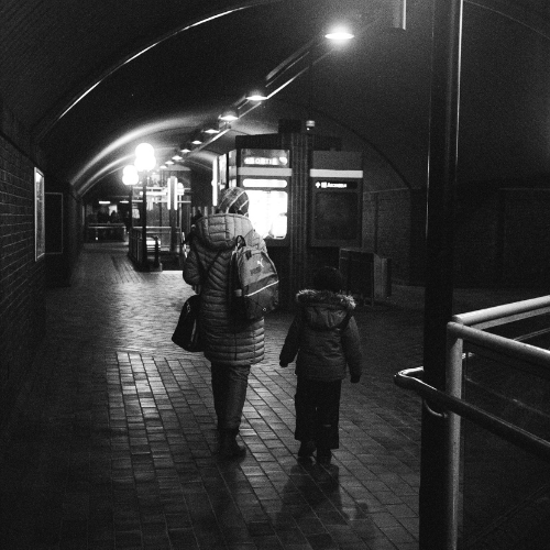 Love; mother, a mother with a kid walking in the metro station